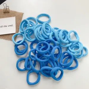 Detailed view of seamless high-elastic hair ties in gradient blue shades with soft texture