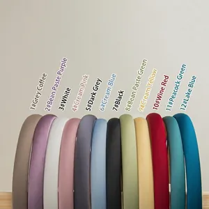 Set of 12 solid color padded satin headbands in diverse elegant tones for women