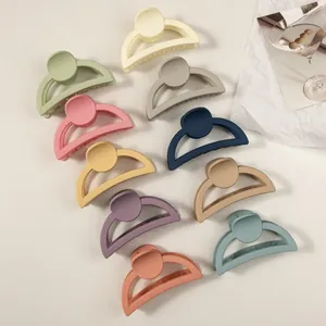 Set of 10 large matte hair claw clips in pastel cream colors for women and girls