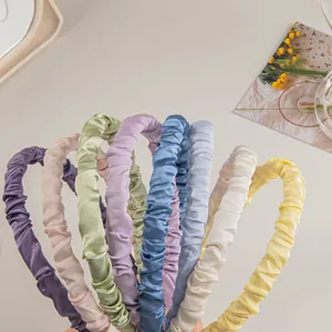 Elegant satin pleated scrunchie headbands in multiple pastel colors for spring hair styling
