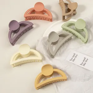 Matte pastel hair claws in multiple colors including orange and green for women