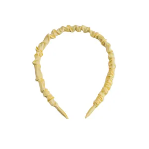 Elegant light yellow pleated satin headband with smooth fabric texture for women