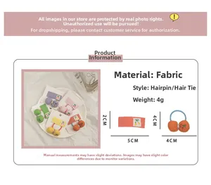 Detail showing cherry embroidery fabric hair clips and ties with precise size measurements