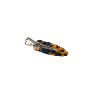 Elegant tortoiseshell acetate hair clip with golden metal base for daily hairstyling