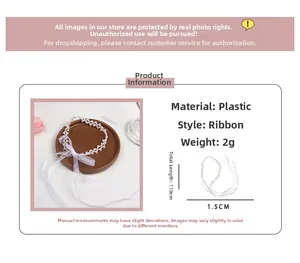 Detail view of a 110cm white pearl ribbon hair tie with dimensions and material specs