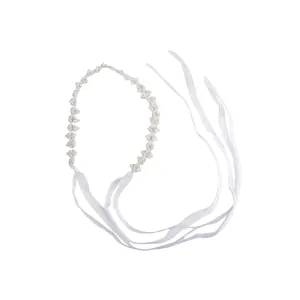 Elegant white pearl headband featuring wavy beaded design and soft mesh ribbons