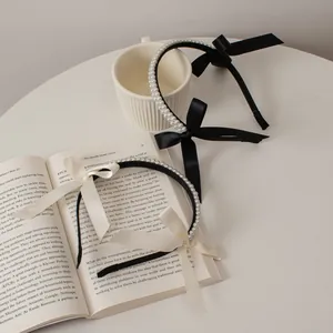 Elegant French style double row pearl headbands with satin bows in black and cream
