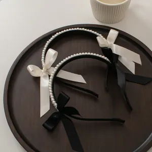 Elegant double-row pearl headbands with satin bows in black and white styles