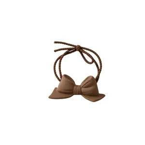 Brown matte bow hair tie with twisted high-elastic rope in minimalist retro style
