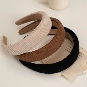 Three-pack corduroy sponge headbands in beige, brown, and black for autumn winter style