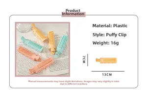 Detail of colorful volumizing hair clips measuring 13cm by 7cm with spec annotations