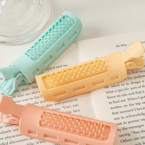 Three-piece hair root volumizing clip set in pastel macaron colors on a vintage book