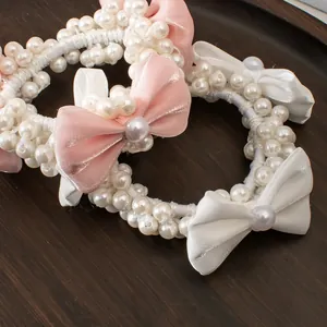 Élastiques à cheveux élégants avec perles et nœuds roses et blancs, lot de deux