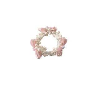 Chouchou en perles roses avec nœuds en satin faits main pour coiffures élégantes