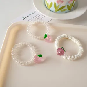 Set de 3 gomas de pelo con colgante de melocotón rosa y coleteros de cable de teléfono