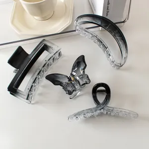 Smoky grey gradient hair claws set in square and butterfly shapes for thick hair