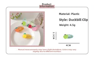 Close-up of strawberry fruit hair clip with product dimensions and 4.5g weight info