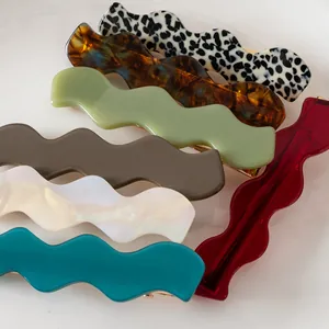 Elegant wavy acetate hair clips in various marble and tortoiseshell patterns for women