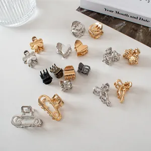 Detailed collection of mini metal hair claws in gold, silver, and bronze geometric shapes