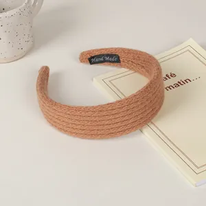 Handmade brown knitted padded headband with thick autumn texture and retro style