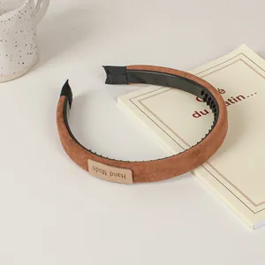 Brown faux suede wide headband with non-slip teeth and handmade label for women