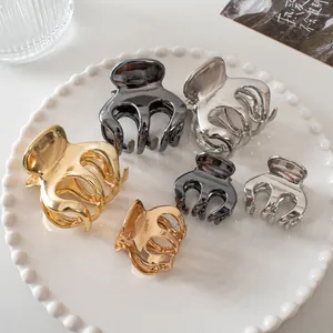 Set of six metallic mini hair claws in gold silver and grey finishes for high ponytail