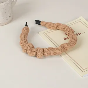 Knitted wave pattern headband in soft camel coffee color with thick sponge texture