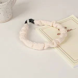Knitted milk white sponge headband with textured pleated fabric for a high cranial top look
