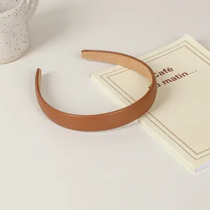 Minimalist brown leather headband in coffee tone with non-slip lining for women