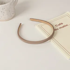 Minimalist coffee brown sponge headband for women with a high crown hair lifting effect