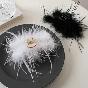 Elegant ostrich feather hair claw clips in black and white colors for stylish hair styling