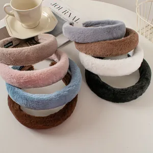Close-up of plush faux rabbit fur headbands with anti-slip lining and hand-made label