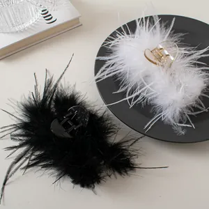Elegant ostrich feather shark hair clips in black and white for a French vintage look