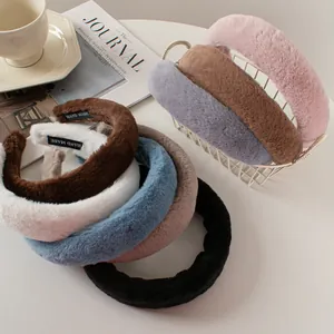 Detail of plush faux rabbit fur headbands with handmade tags in assorted colors