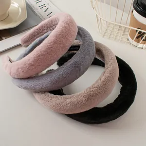 Detail of plush faux rabbit fur headbands in pink, gray, black and brown colors