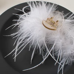 Elegant white ostrich feather hair claw clip on black plate for women styling