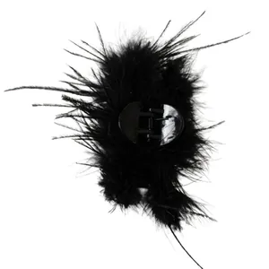 Elegant black ostrich feather shark hair claw clip for women in a minimalist style