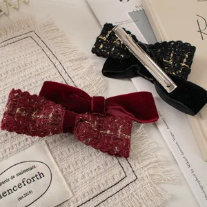 Velvet and tweed double bow hair clips in black and burgundy with gold thread details