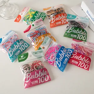 Detail of 100pcs high elasticity 25mm PU hair ties in candy colors with clear packaging