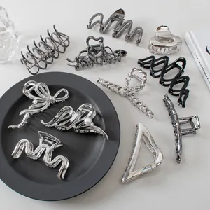 Silver metal hair claw clips collection with minimalist designs for women's hairstyling