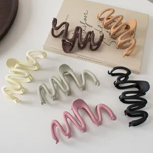 6-piece set of matte wave-shaped hair claw clips in various elegant colors for women