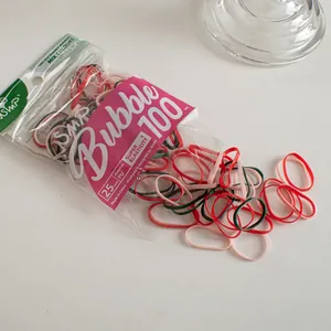 Macro shot of colorful high-elastic hair bands in red, pink, and dark green 100pcs pack