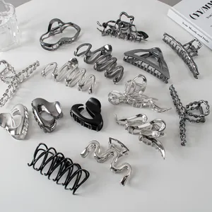 Collection of minimalist metal hair claw clips in silver and charcoal for women hair styling