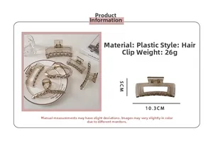 Detail of transparent grey claw clip showing 10.3cm length and 26g weight specifications
