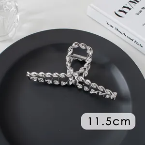 Detail view of large 11.5cm silver twisted metal hair claw clip for thick hair styling