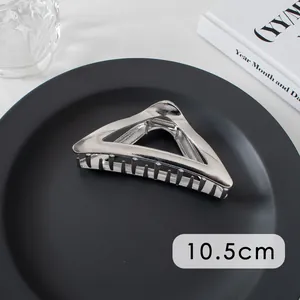 Detailed view of a 10.5cm silver metal hair claw clip with non-slip teeth for styling