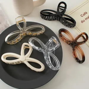 Set of large 13cm ribbon-style hair claws in multiple colors including black and amber