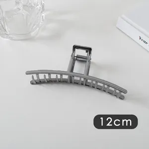 Detail of 12cm gunmetal hair claw clip with strong spring and minimalist metallic finish