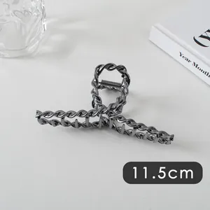 Detailed close-up of 11.5cm gunmetal twisted chain hair claw clip with mirror finish