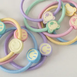 Lot d'élastiques à cheveux macaron avec de jolis accessoires sourire et ours